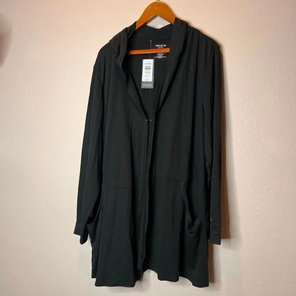 Torrid Active brand hoodie is a versatile black featuring pockets and a relaxed